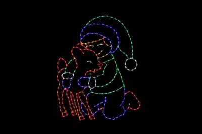 Boy with a fawn deer friend Christmas light display