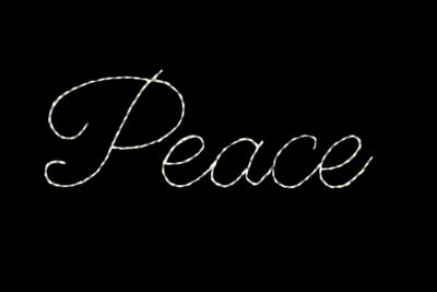Peace word sign Christmas light display